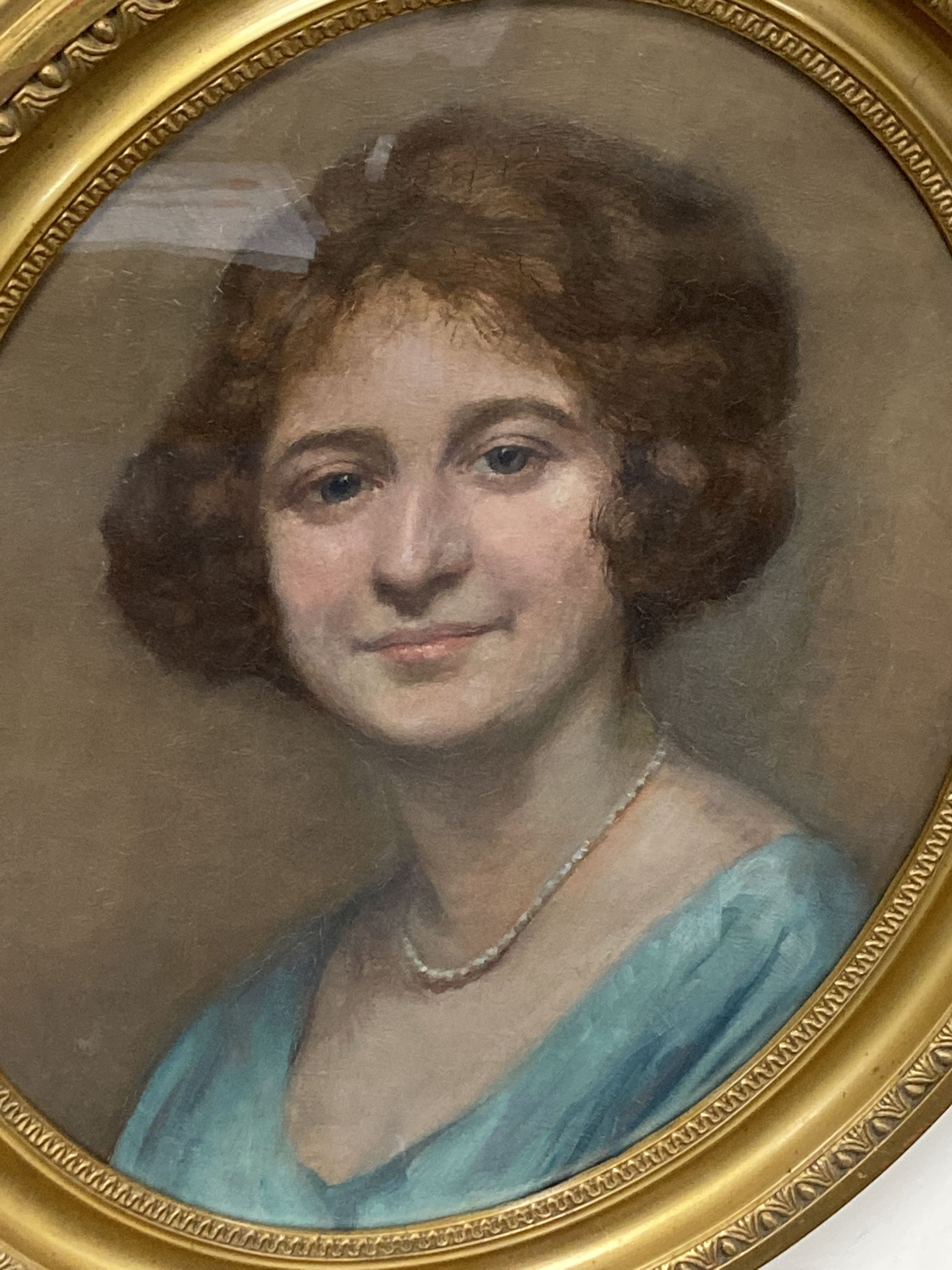 Early 20th century English School, oil on card, Portrait of a lady wearing a pearl necklace, 50 x 39cm